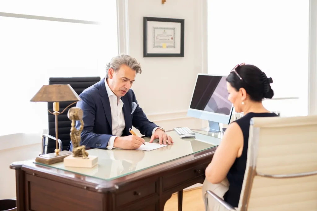 Cardiologist Dr Francesco Lo Monaco in a face-to-face consultation with a patient during a private heart assessment