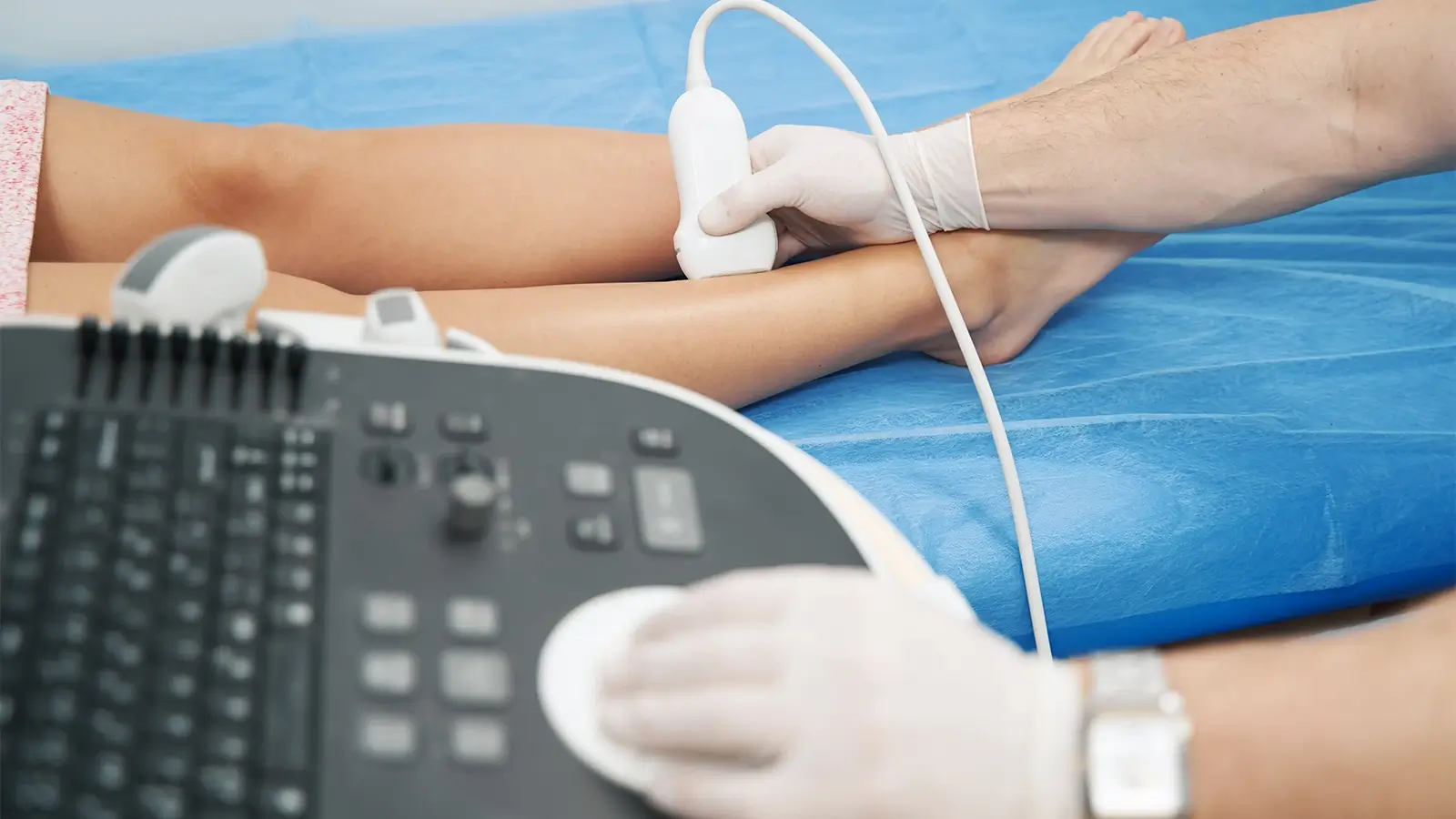 Cardiologist Dr Francesco Lo Monaco carrying out a cardiac diagnostic examination on a patient